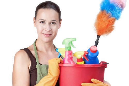 Professional carpet cleaner working in an Ilford living room