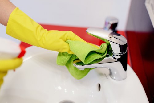 Office cleaners working in a busy Ilford workplace reception area