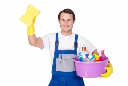 A local cleaning team working in an Ilford home with detailed surface cleaning
