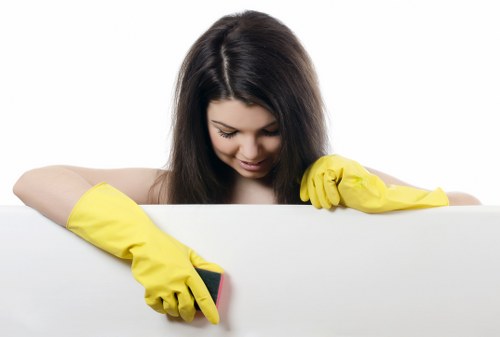 Professional cleaner working in a busy Ilford residential property